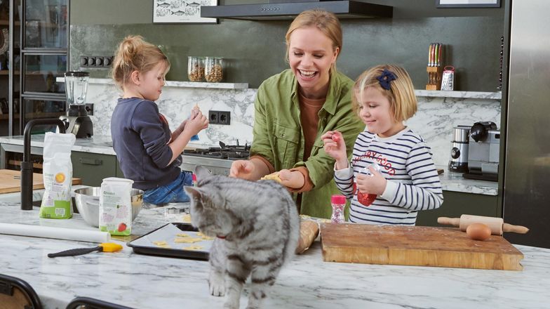 Mother in the kitchen with her children